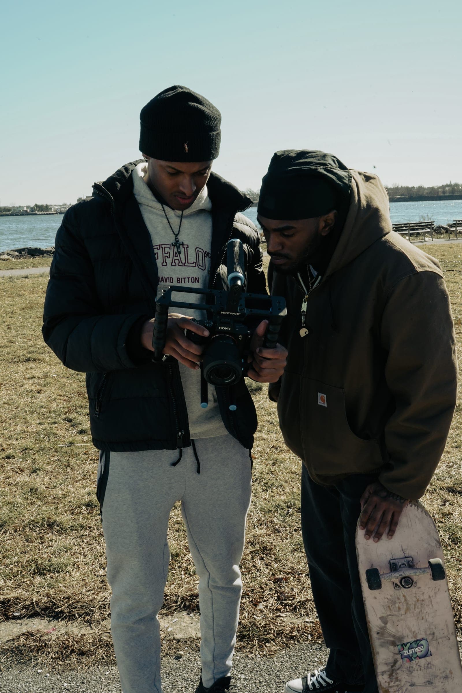 Alijah reviewing footage on the camera monitor with a collaborator